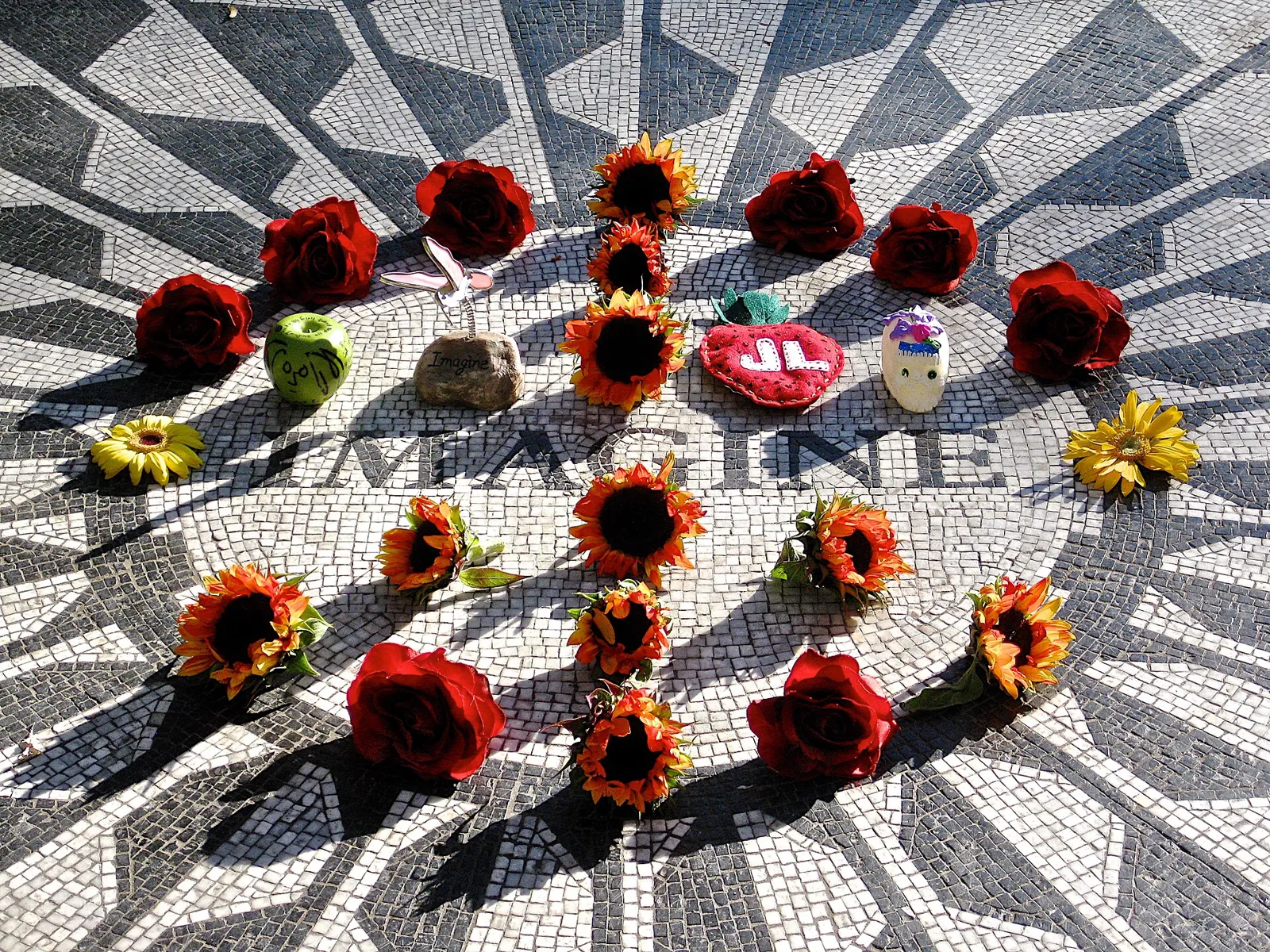 Imagine mosaic at Strawberry Fields in Central Park, with flowers and tributes